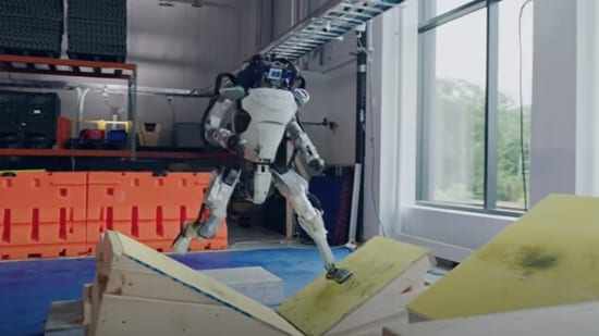 The images shows a robot attempting a parkour obstacle course.(YouTube/@Boston Dynamics)