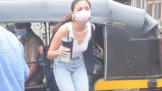 Alia Bhatt hops out of an auto rickshaw in Mumbai.