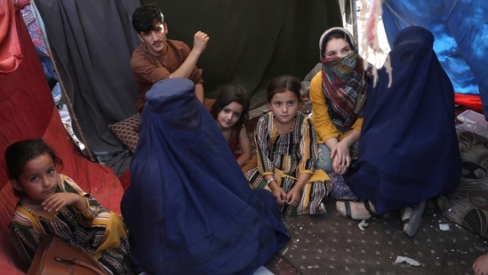 Women from Takhar province sit inside her tent in a public park in Kabul.(AP Photo) Women from Takhar province sit inside her tent in a public park in Kabul.(AP Photo)