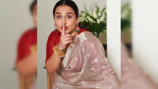Vidya Balan accessorised her look with a pair of long earrings and golden bangles.(Instagram/@vidyabalan)