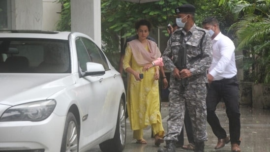 Kangana wore the kurta with straight fit pants in the same sunny yellow shade. She teamed the suit with a blush pink dupatta, nailing colour-blocking fashion with pastel hues. (HT Photo/Varinder Chawla)