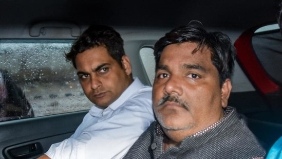 Suspended AAP councillor Tahir Hussain (right) is accused of being involved in the Delhi riots that took place in February. (File Photo / PTI)