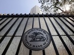 The Reserve Bank of India seal is pictured on a gate outside the RBI headquarters in Mumbai. 