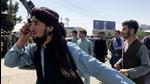 A member of Taliban forces inspects the area outside Hamid Karzai International Airport in Kabul, Afghanistan. (REUTERS) A member of Taliban forces inspects the area outside Hamid Karzai International Airport in Kabul, Afghanistan. (REUTERS)