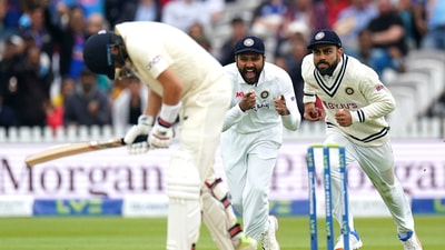 India's Virat Kohli, right, celebrates catching the ball to dismiss England's Joe Root. (AP) India's Virat Kohli, right, celebrates catching the ball to dismiss England's Joe Root. (AP)