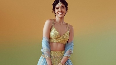 Shanaya Kapoor wore a lime green lehenga and choli with a powder blue dupatta from Manish Malhotra's Mijwan collection. (Instagram) Shanaya Kapoor wore a lime green lehenga and choli with a powder blue dupatta from Manish Malhotra's Mijwan collection. (Instagram)