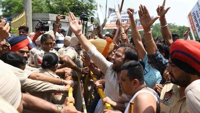 In the confrontation between the police and BJYM, the youth wing of the BJP, the protesters raised slogans against the Congress and Sidhu. (AFP photo)
