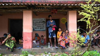 Residents shelter inside a primary school building in Balasore district of Odisha state on May 26, 2021 as Cyclone Yaas barrels towards India's eastern coast in the Bay of Bengal. (Photo by Dibyangshu SARKAR / AFP) (AFP) Residents shelter inside a primary school building in Balasore district of Odisha state on May 26, 2021 as Cyclone Yaas barrels towards India's eastern coast in the Bay of Bengal. (Photo by Dibyangshu SARKAR / AFP) (AFP)