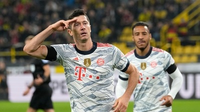 Bayern's Robert Lewandowski celebrates after scoring his side's third goal during the German Supercup soccer match between Borussia Dortmund and Bayern Munich in Dortmund, Germany, Tuesday, Aug. 17, 2021. (AP Photo/Martin Meissner) (AP)