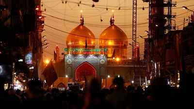 Shiite faithful pilgrims gather outside the golden-domed shrine of Imam Moussa al-Kadhim during a Muharram procession in Baghdad, Iraq, on Wednesday, Aug. 18, 2021. (Representational Image / AP) Shiite faithful pilgrims gather outside the golden-domed shrine of Imam Moussa al-Kadhim during a Muharram procession in Baghdad, Iraq, on Wednesday, Aug. 18, 2021. (Representational Image / AP)