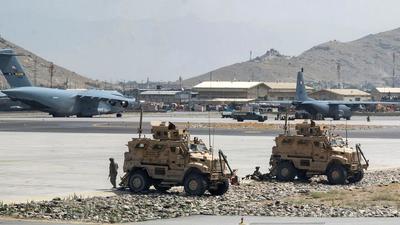 US Army soldiers assigned to the 82nd Airborne Division patrol Hamid Karzai International Airport in Kabul, Afghanistan. (REUTERS)