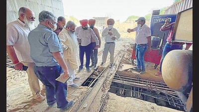 Cabinet minister Bharat Bhushan Ashu inspecting the construction work of the Pakhowal Road rail under bridge in Ludhiana on Thursday. (HT photo) Cabinet minister Bharat Bhushan Ashu inspecting the construction work of the Pakhowal Road rail under bridge in Ludhiana on Thursday. (HT photo)