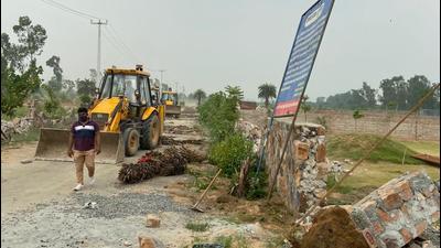 DTCP officials said that a police team of 100 personnel was also called in to provide support for the drive, in which the boundary wall, road network, light poles and guardrooms were demolished. DTCP officials said that a police team of 100 personnel was also called in to provide support for the drive, in which the boundary wall, road network, light poles and guardrooms were demolished.