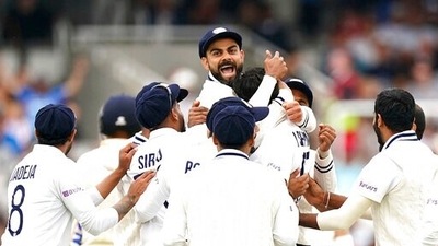 India's Virat Kohli, top, celebrates with teammates. (AP)