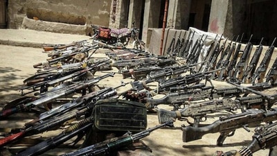 Taliban showcasing seized weapons from fleeing Afghan and allied forces.