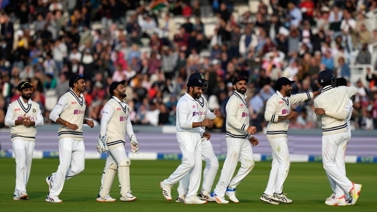 Members of the Indian cricket team line up to congratulate India's Mohammed Siraj.(AP)