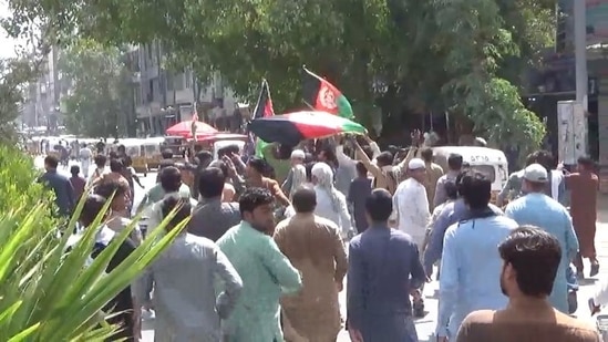 People carry Afghan flags as they take part in an anti-Taliban protest in Jalalabad, Afghanistan.(via Reuters)