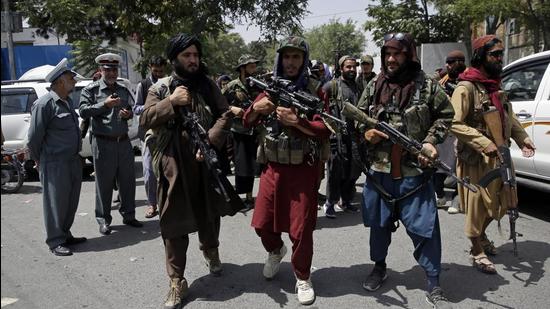 Taliban fighters patrol a street in Kabul, Afghanistan, on Thursday. (AP) Taliban fighters patrol a street in Kabul, Afghanistan, on Thursday. (AP)