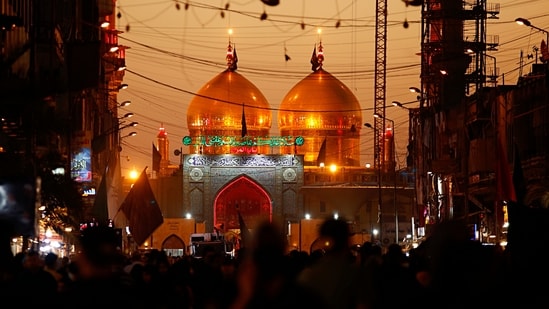 Shiite faithful pilgrims gather outside the golden-domed shrine of Imam Moussa al-Kadhim during a Muharram procession in Baghdad, Iraq, on Wednesday, Aug. 18, 2021. (Representational Image / AP)