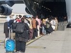 Close to 800 NATO civilian personnel had worked to keep the Kabul international airport running, a statement said. In picture - Evacuees board a C-17 Globemaster III during an evacuation at Hamid Karzai International Airport, Afghanistan.