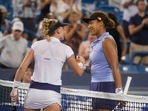 Jil Teichmann, left, of Switzerland, is congratulated by Naomi Osaka, of Japan, on Teichmann's win during the Western & Southern Open tennis tournament Thursday, Aug. 19, 2021, in Mason, Ohio. (AP Photo/Darron Cummings)(AP) Jil Teichmann, left, of Switzerland, is congratulated by Naomi Osaka, of Japan, on Teichmann's win during the Western & Southern Open tennis tournament Thursday, Aug. 19, 2021, in Mason, Ohio. (AP Photo/Darron Cummings)(AP)