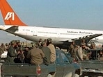 Taliban fighters surrounded the plane that was forced to land at the Kandahar airport in 1999. (File Photo: AP)