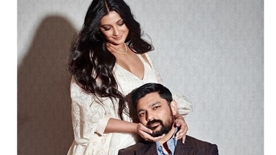 Rhea Kapoor took to her social media feed and shared images of herself twirling around in a stunning white ensemble, in one picture she posed alongside husband Karan Boolani. (Instagram) Rhea Kapoor took to her social media feed and shared images of herself twirling around in a stunning white ensemble, in one picture she posed alongside husband Karan Boolani. (Instagram)