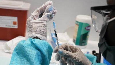 A health care worker fills a syringe with the Pfizer Covid-19 vaccine in New York, US. (AP Photo) A health care worker fills a syringe with the Pfizer Covid-19 vaccine in New York, US. (AP Photo)