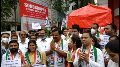 NCP party workers stage a “prayer protest” outside a temple which housed the bust of PM Narendra Modi, now closed, in Pune. Following severe criticism, BJP workers late on Wednesday removed the statue. (HT) NCP party workers stage a “prayer protest” outside a temple which housed the bust of PM Narendra Modi, now closed, in Pune. Following severe criticism, BJP workers late on Wednesday removed the statue. (HT)