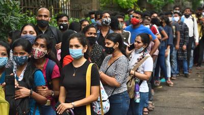 Employees of retail shops and shopping malls wait to get inoculated outside Wadia Hospital, Parel, in Mumbai on Friday. (Satish Bate/HT PHOTO) Employees of retail shops and shopping malls wait to get inoculated outside Wadia Hospital, Parel, in Mumbai on Friday. (Satish Bate/HT PHOTO)