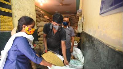 A shopkeeper filling a customer's sack with wheat grain at a ration shop in Rani Garden in New Delhi (Raj K Raj / HT Photo) A shopkeeper filling a customer's sack with wheat grain at a ration shop in Rani Garden in New Delhi (Raj K Raj / HT Photo)