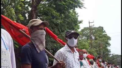 File photo: CPM members hold posters as they stage protest in Agartala. (ANI)