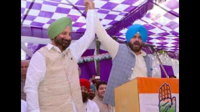 Punjab jails and cooperation minister Sukhjinder Singh Randhawa (left), who backed state unit chief Navjot Singh Sidhu (right) in the recent power struggle, has been critical of chief minister Capt Amarinder Singh and his aides over unfulfilled poll promises, particularly the delay in action in the 2015 sacrilege and police firing cases. (Sameer Sehgal/HT file photo) Punjab jails and cooperation minister Sukhjinder Singh Randhawa (left), who backed state unit chief Navjot Singh Sidhu (right) in the recent power struggle, has been critical of chief minister Capt Amarinder Singh and his aides over unfulfilled poll promises, particularly the delay in action in the 2015 sacrilege and police firing cases. (Sameer Sehgal/HT file photo)