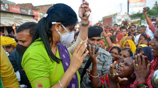 Apna Dal MP and minister of state for commerce and industry Anupriya Patel interacts with her supporters during her Jan Ashirwad Yatra in Mirzapur on Thursday, August 19. (PTI)