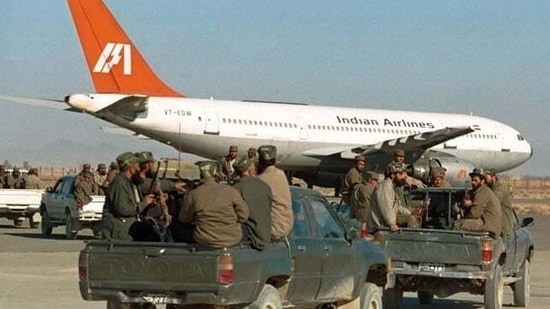 Taliban fighters surrounded the plane that was forced to land at the Kandahar airport in 1999. (File Photo: AP)