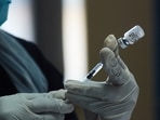 A health worker prepares a dose of the Pfizer-BioNTech Covid-19 vaccine. 