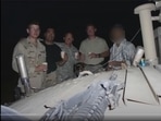 Scott Henkel, second to the right, poses for a photo with other troop members and the Afghan interpreter, nicknamed Scott Henkel, second to the right, poses for a photo with other troop members and the Afghan interpreter, nicknamed
