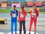 17-year-old Amit Khatri (L) win silver medal in the 10,000m race walk event at the World Athletics U20 Championships