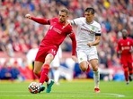 Liverpool's Jordan Henderson, left, and Burnley's Jack Cork battle for the ball during the English Premier League soccer match between Liverpool and Burnley at Anfield(AP) Liverpool's Jordan Henderson, left, and Burnley's Jack Cork battle for the ball during the English Premier League soccer match between Liverpool and Burnley at Anfield(AP)