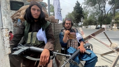 "Because of potential security threats outside the gates at the Kabul airport, we are advising U.S. citizens to avoid traveling to the airport," the US embassy in Kabul said. In picture - Taliban militants sit at a checkpost in Kabul. (Reuters)