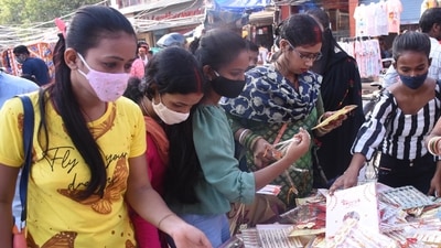 Women shop for rakhis ahead of Raksha Bandhan festival, at Boring Road, in Patna, Bihar.  (Santosh Kumar /Hindustan Times)