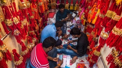 Wholesale vendors of Rakhis work inside their shops ahead of Raksha Bandhan festival at Dharavi, in Mumbai.  (Pratik Chorge/Hindustan Times)