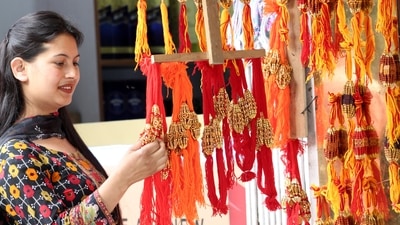 A woman shops for Rakhis ahead of Raksha Bandhan festival in Kullu, Himachal Pardesh.  (Aqil Khan/Hindustan Times)