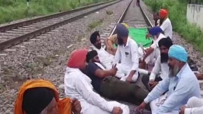 Farmers block a railway track in Jalandhar (ANI)