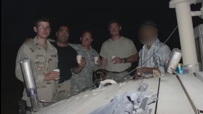 Scott Henkel, second to the right, poses for a photo with other troop members and the Afghan interpreter, nicknamed "Kevin", on the right. (Photo via Daily Camera, courtesy Scott Henkel) Scott Henkel, second to the right, poses for a photo with other troop members and the Afghan interpreter, nicknamed "Kevin", on the right. (Photo via Daily Camera, courtesy Scott Henkel)