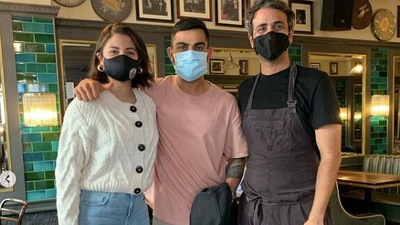 Anushka Sharma and Virat Kohli pose with chef Rishim Sachdeva.