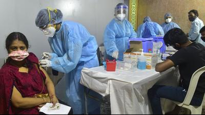 A health worker inoculates a beneficiary against Covid-19 at a free vaccination camp organised by Shiv Sena councillor Arun Dudhwadkar at Tardeo in Mumbai. (Anshuman Poyrekar/HT PHOTO.)