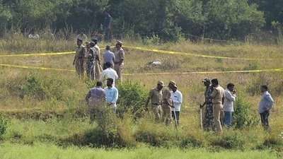 Police officials stand guard in an area where four accused in the rape-and-murder case of a young veterinary surgeon were shot dead by the police in an alleged encounter in Hyderabad. (File Photo / PTI) Police officials stand guard in an area where four accused in the rape-and-murder case of a young veterinary surgeon were shot dead by the police in an alleged encounter in Hyderabad. (File Photo / PTI)