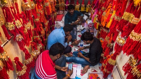 Wholesale vendors of Rakhis work inside their shops ahead of Raksha Bandhan festival at Dharavi, in Mumbai. (Pratik Chorge/Hindustan Times)