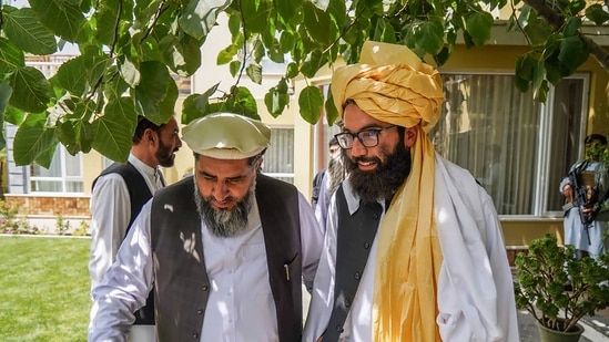A Taliban delegation led by the head of the negotiating team Anas Haqqani (R) meeting with former Afghan government officials in Afghanistan.(AFP)